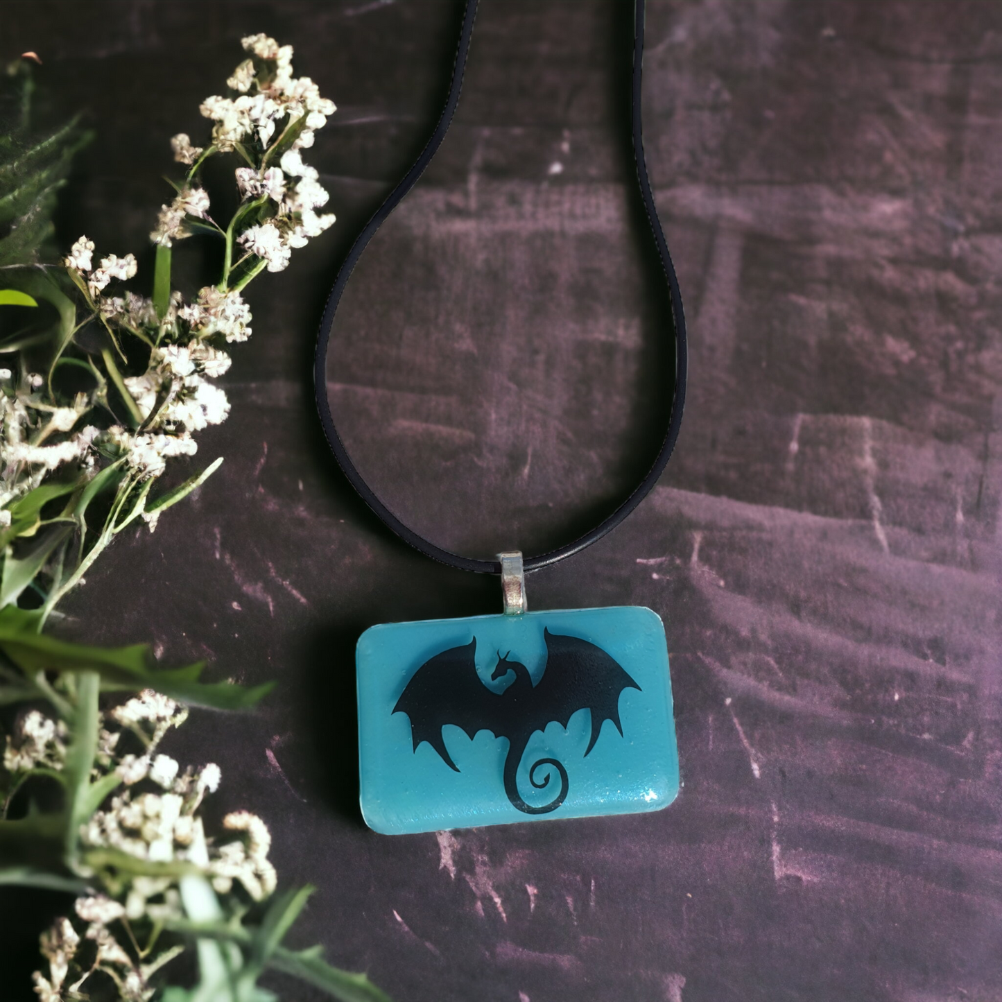 Blue glass dragon necklace