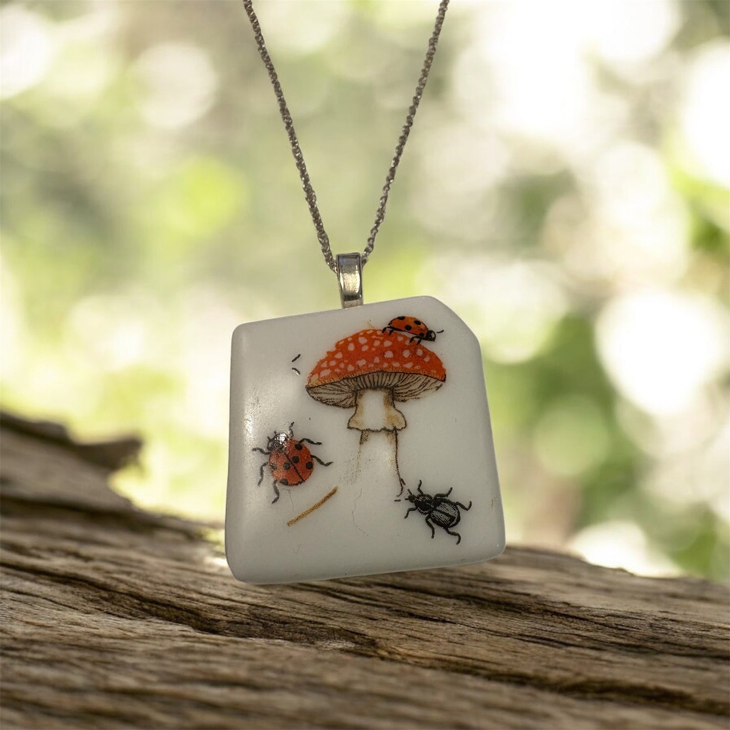Toadstool and bugs glass necklace